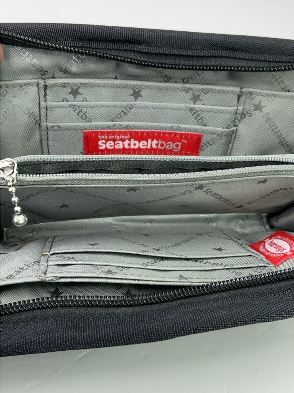 Harveys Seatbelt Bag wallet features black woven webbing and a gray. - Picture 7 of 11